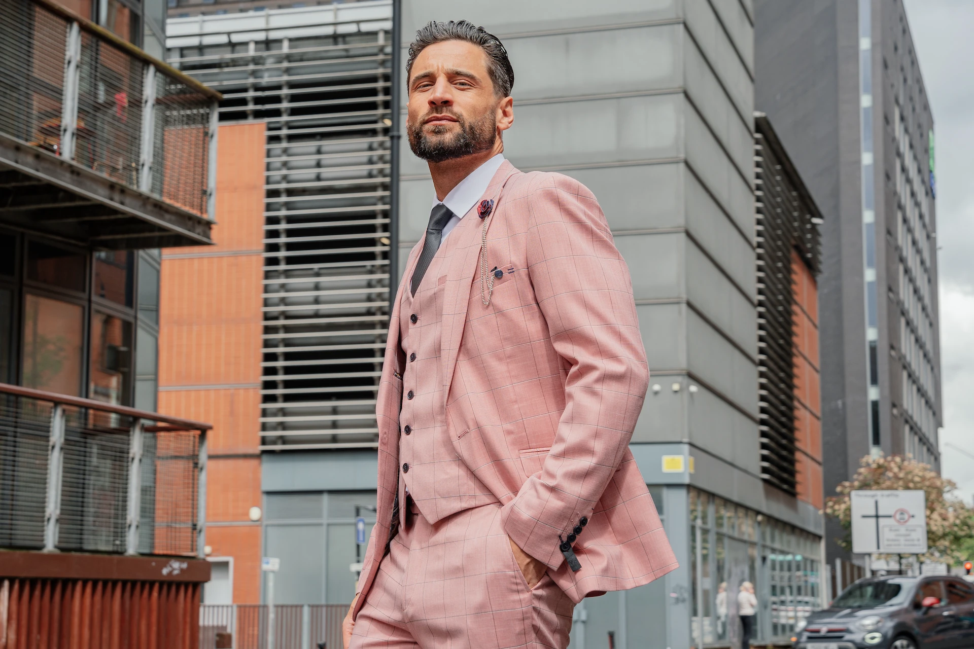 Man wearing a pink checked V2 Classic three-piece suit in support of Beat Breast Cancer