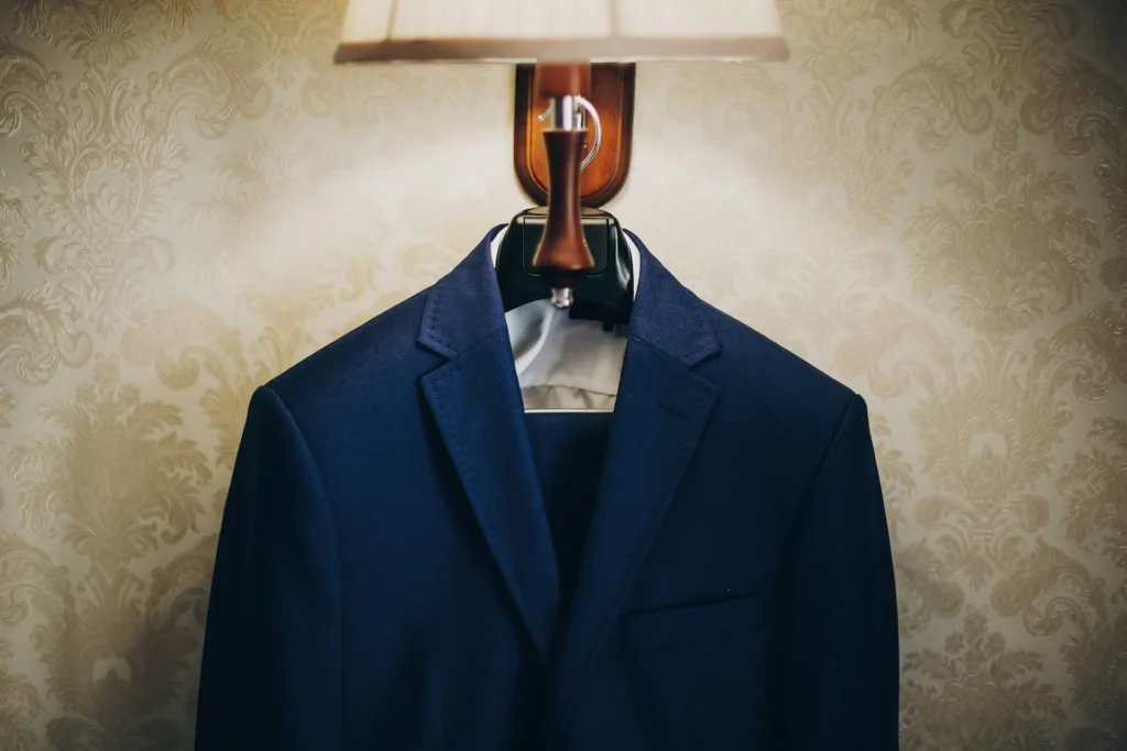 Stylish blue suit for groom hanging on lamp in hot 2023 11 27 05 08 23 utc